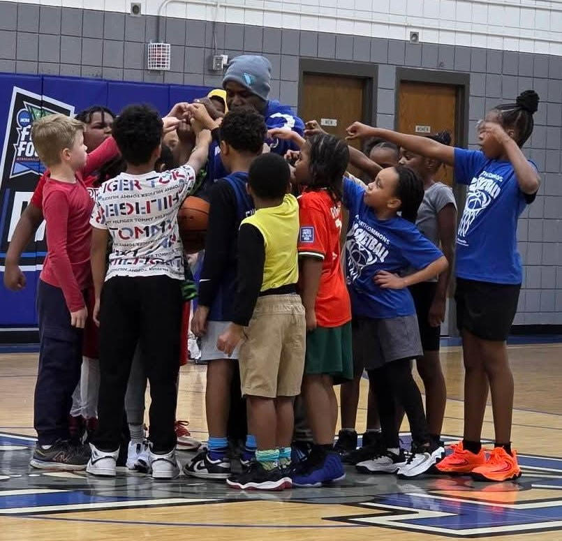 Bud Adail leading a youth huddle
